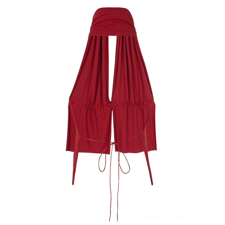 Flat lay view of a red halter keyhole peplum top with ruched drawstring waist and long self-tie straps