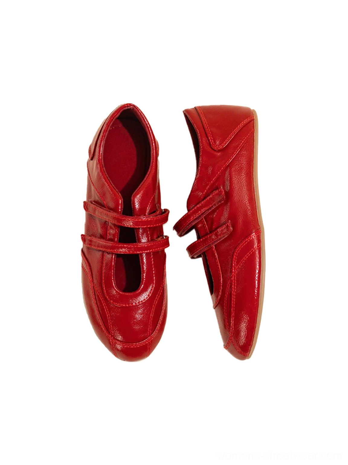 Side view of red leather-look ballet flats showing slim crossed straps and glossy flat sole