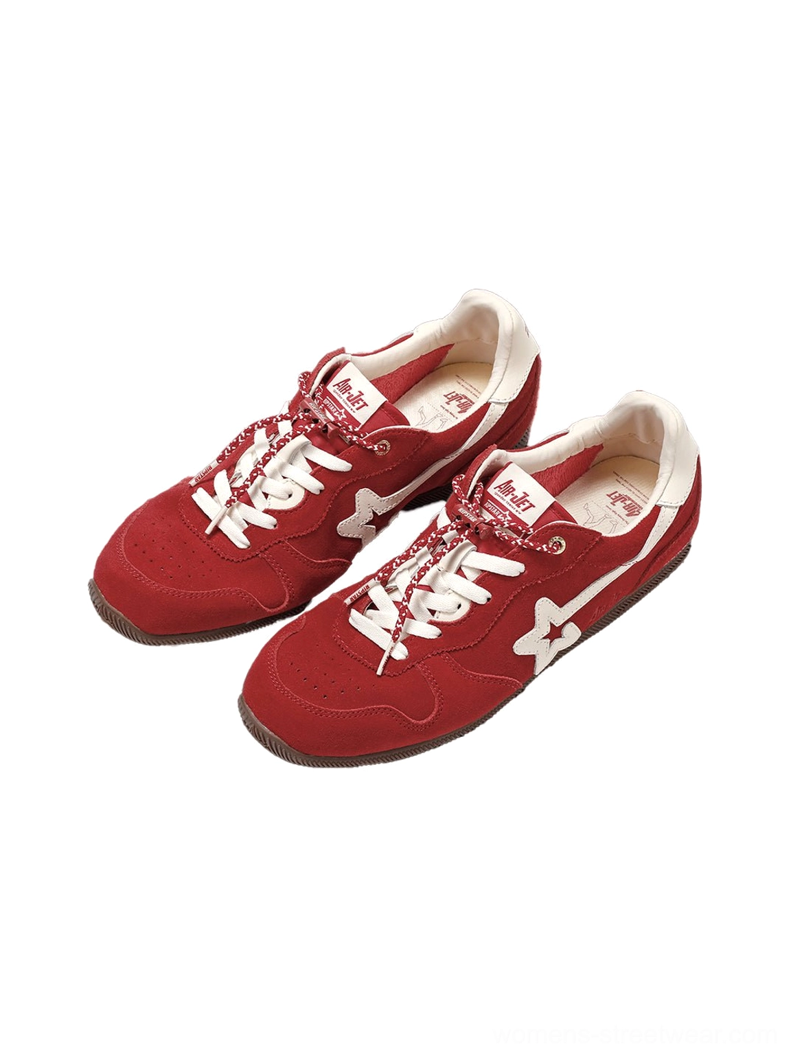 Pair of red low-profile retro suede panel sneakers with white laces, star-inspired side accents, and off-white rubber soles