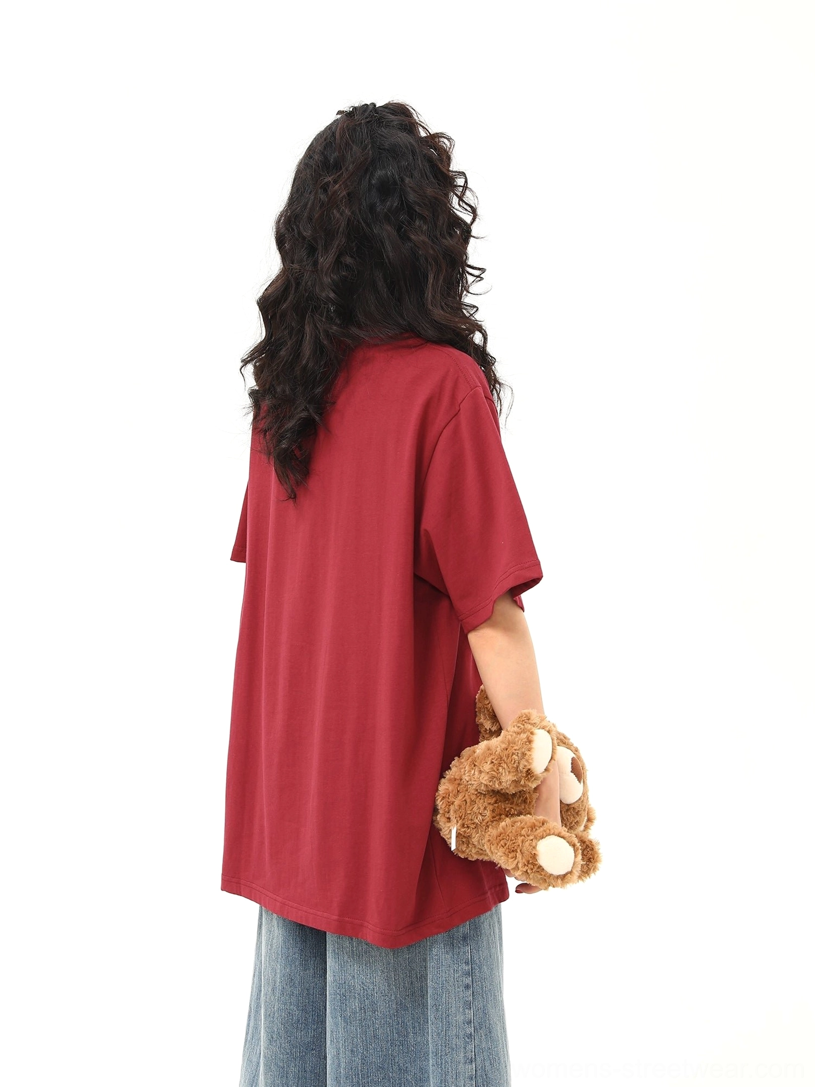 Back view of red oversized short sleeve streetwear T-shirt showing the relaxed drop shoulder silhouette and plain back