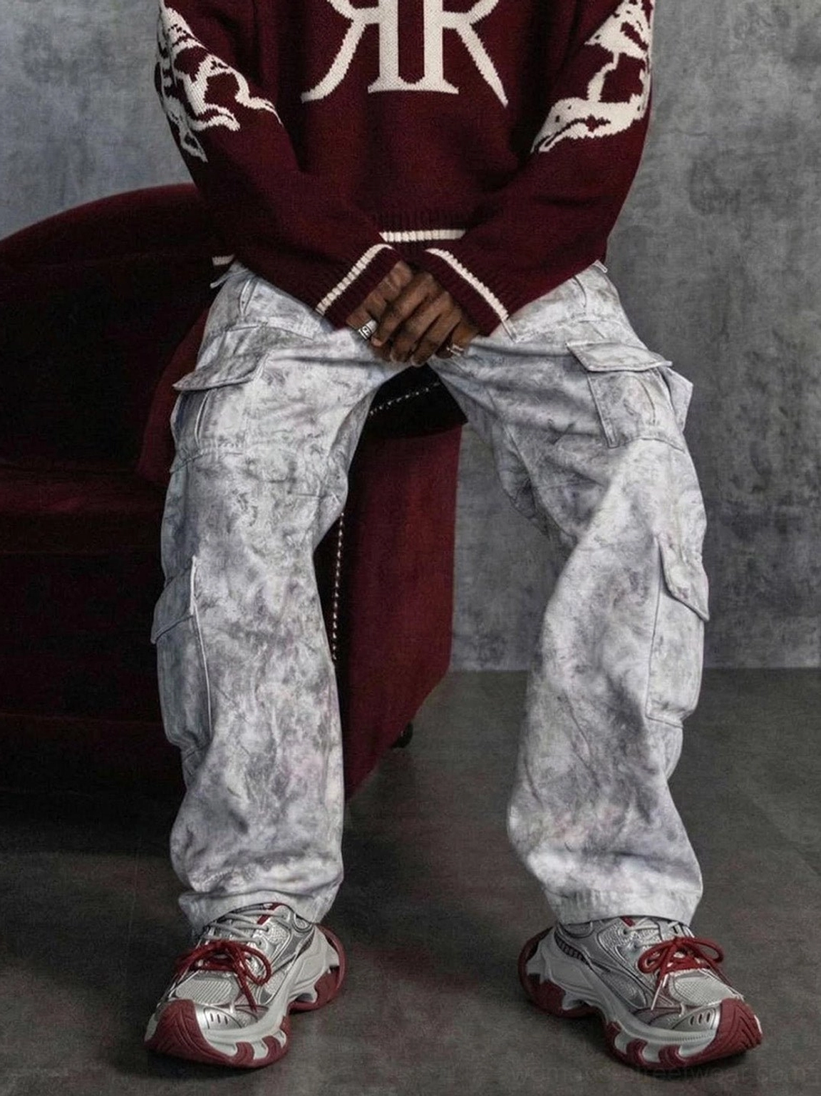 Metallic silver and burgundy platform sneakers worn with a burgundy sweater in a bold Korean streetwear outfit