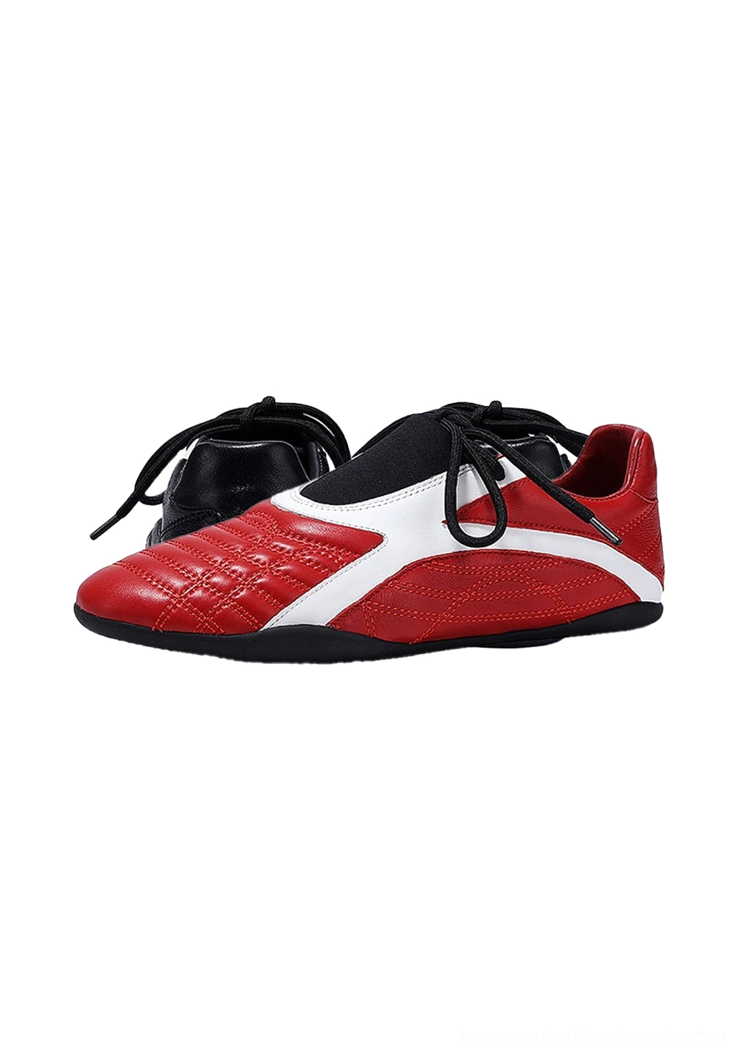 Front three-quarter close-up of red quilted toe box sneakers with white instep panel and contrasting black lace-up detail
