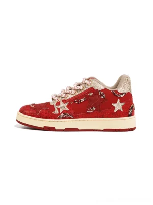 Side view of red snake-embossed star court sneakers with white star panels, pink-silver rope laces, and off-white rubber outsole