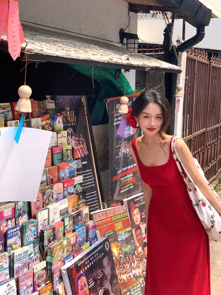 Front angled view of a red square neck sleeveless maxi dress with fitted bodice and flowing skirt styled for modern retro streetwear