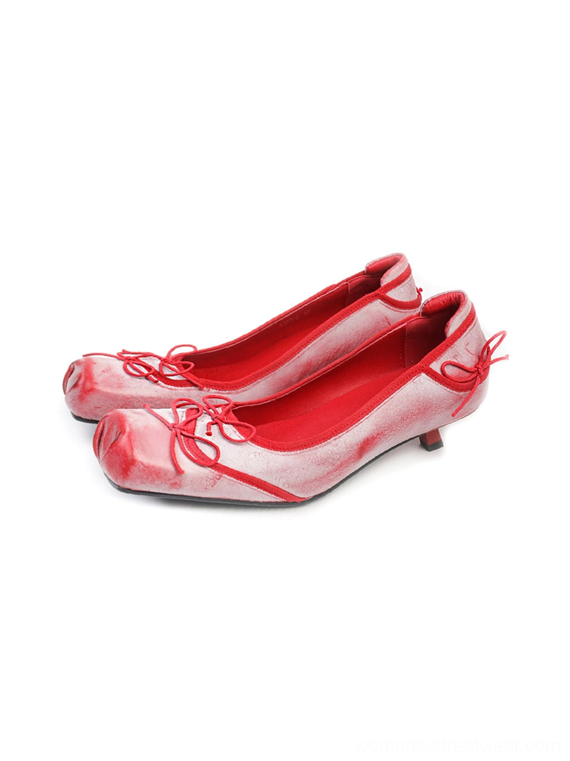 Front three-quarter view of red and off-white washed square-toe ballet flats with red bows, lining, and kitten heels