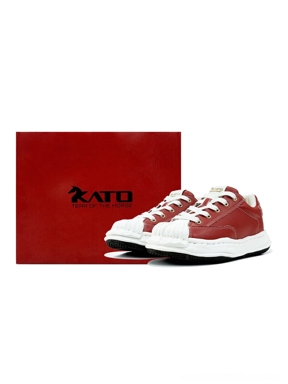 Front studio view of red synthetic-leather court sneakers with white shell toes and matching red packaging