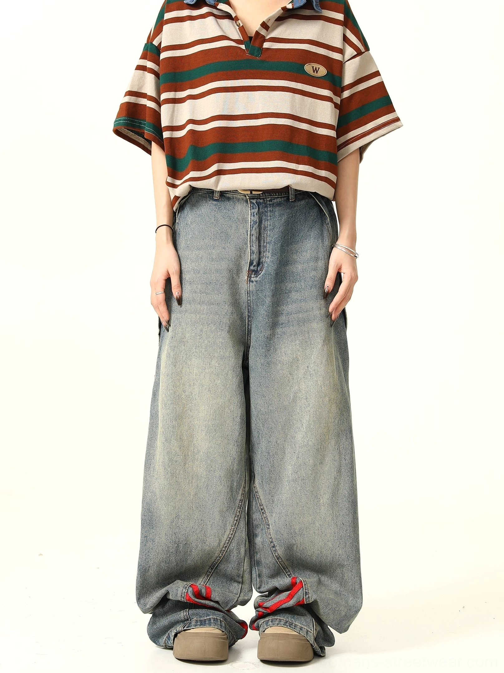 Front full-body view of light blue wide-leg denim jeans with bold red triple stripes and vintage faded streetwear wash