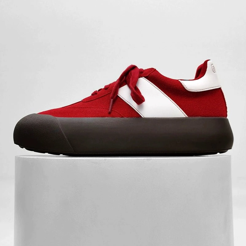 Red and white color block chunky retro sneakers with brown platform outsole and classic lace up streetwear design