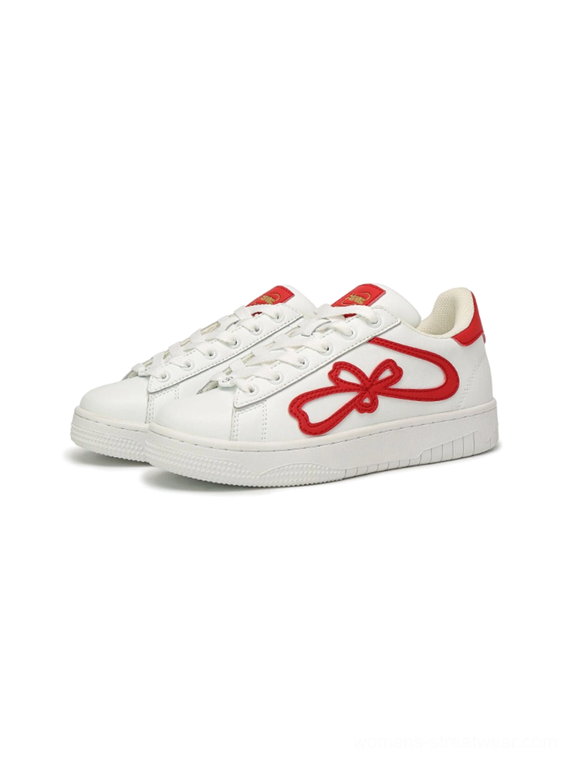 Pair of red and white lucky clover platform sneakers displayed from the front side angle