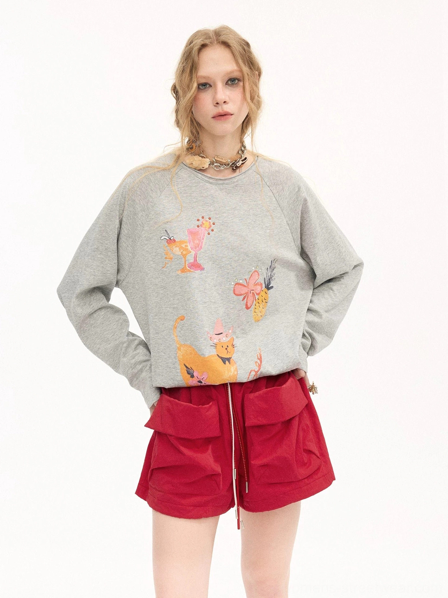 Red women’s utility pocket shorts with elastic drawstring waist, oversized flap cargo pockets, and relaxed Korean streetwear styling