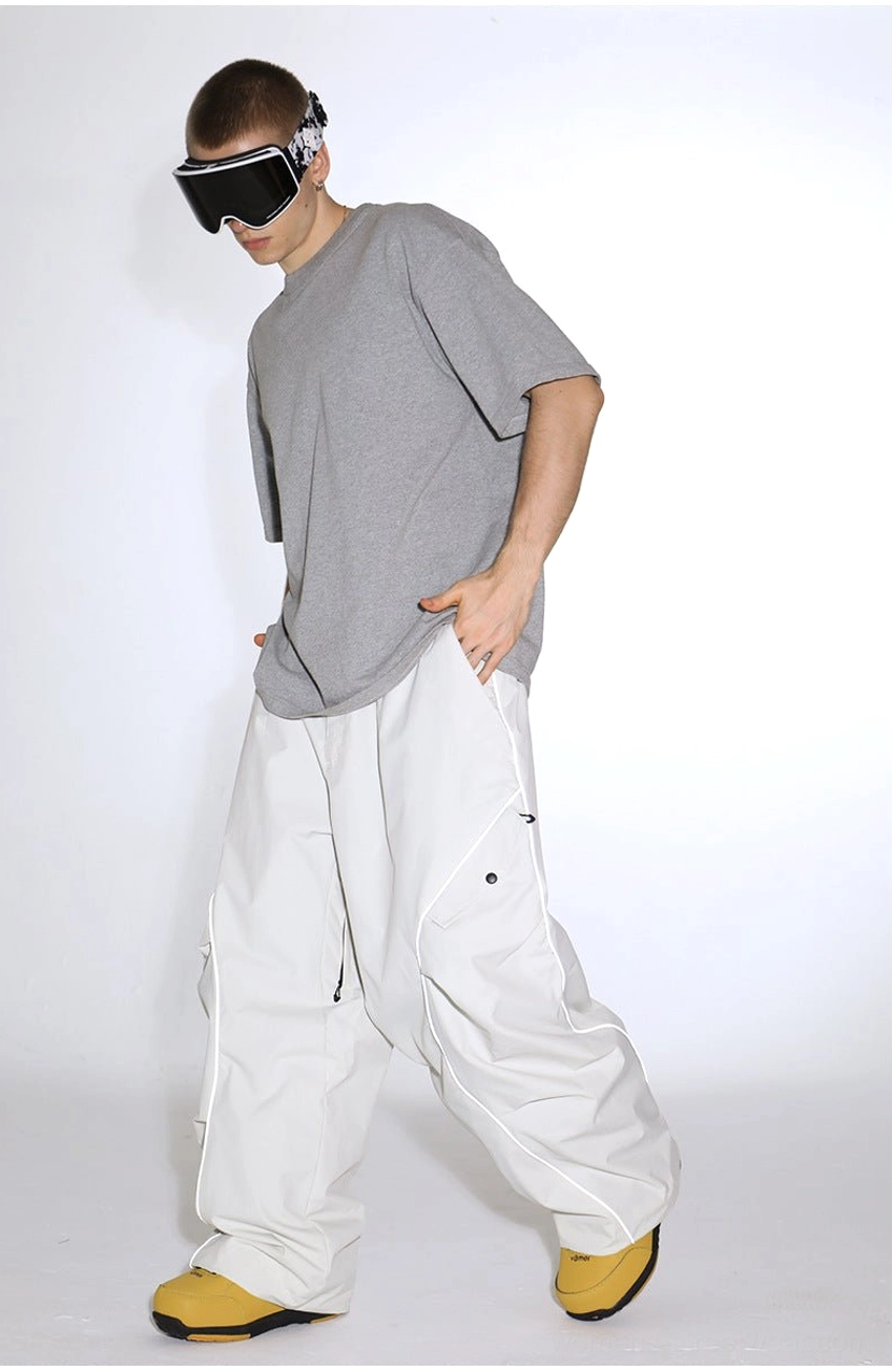 Reflective piped baggy snow pants with durable nylon shell and loose streetwear cargo silhouette