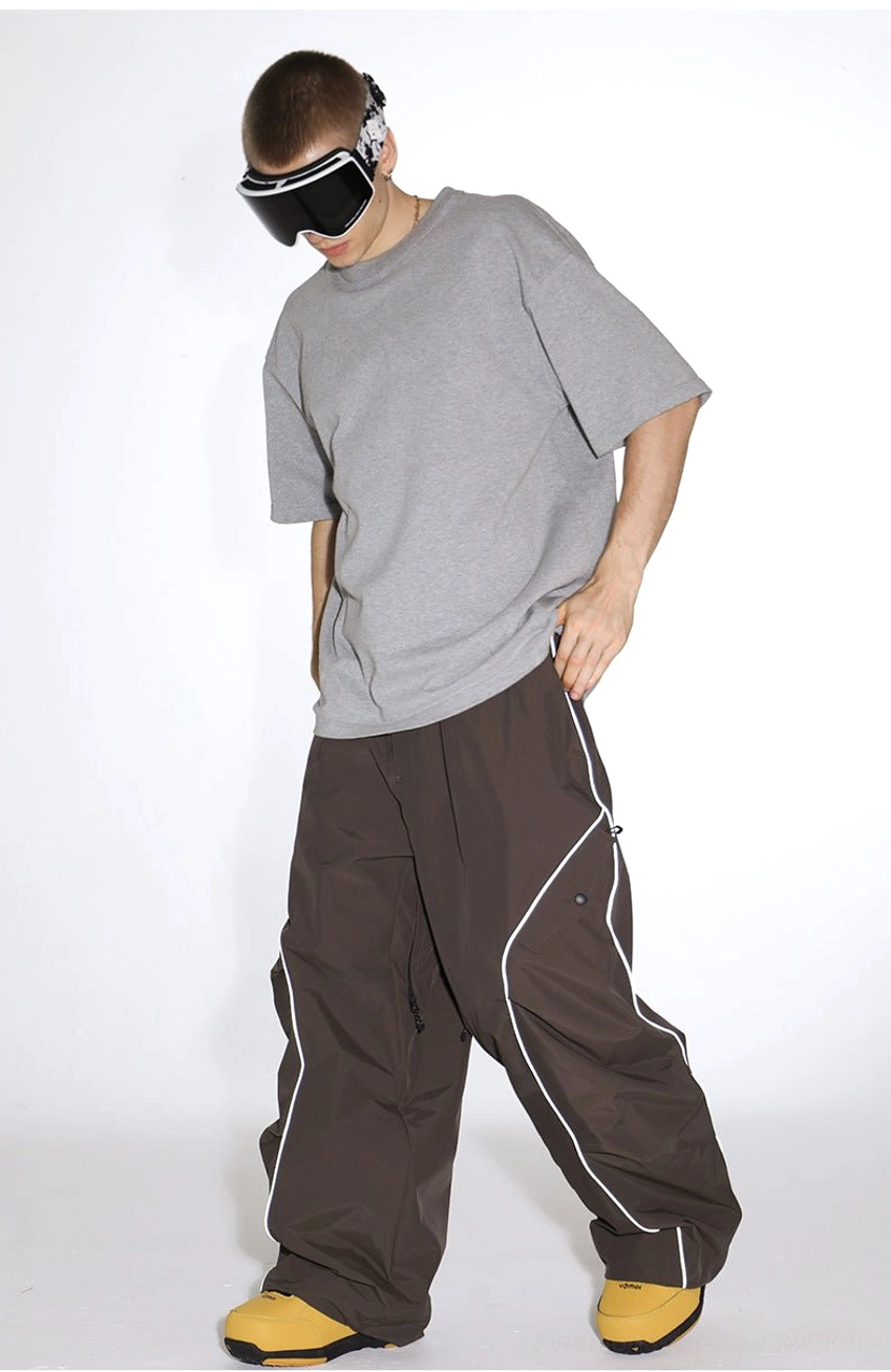 Reflective piped baggy snowboard cargo pants technical winter streetwear product detail view