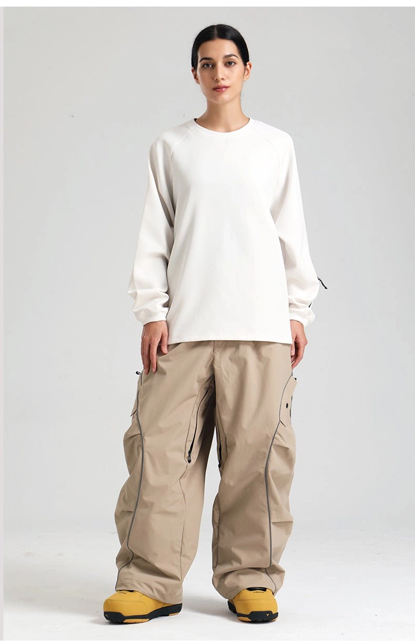 Reflective piping detail on loose wide-leg snowboard cargo pants for technical winter streetwear