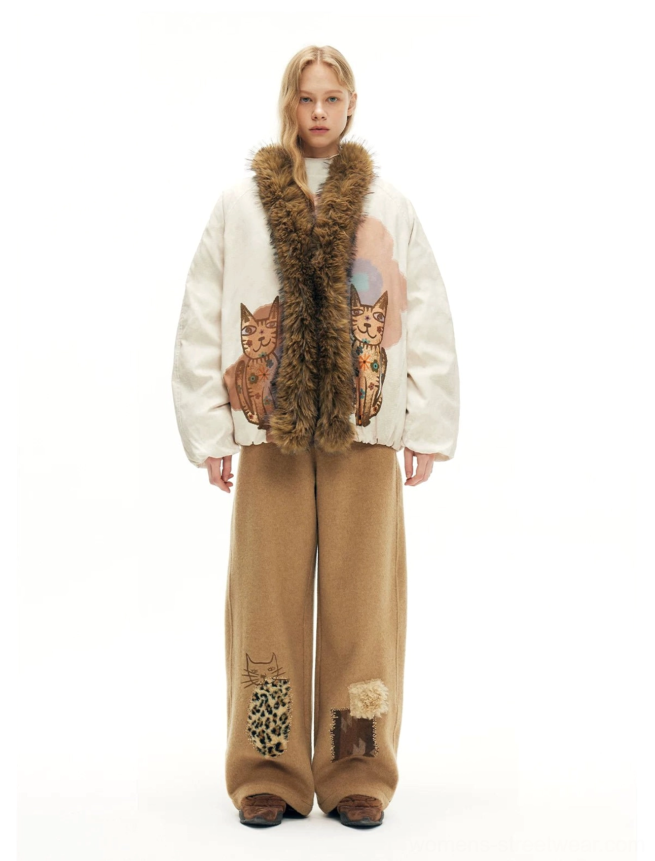 Relaxed beige cat graphic faux fur bomber jacket with shaggy brown trim and painterly floral details