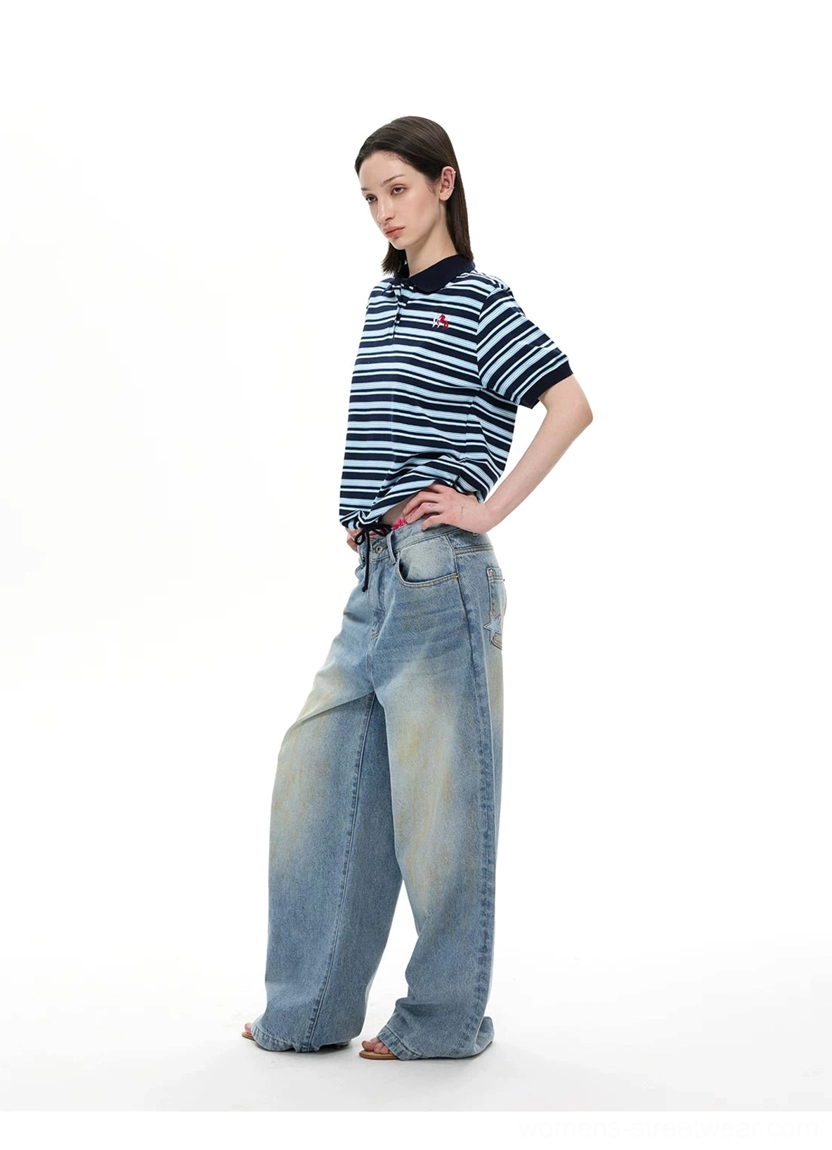 Relaxed boxy navy blue striped polo shirt with short sleeves and contrast navy collar side view