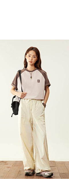 relaxed nylon cargo pants cream off-white high-waisted wide-leg adjustable ankle hem pockets