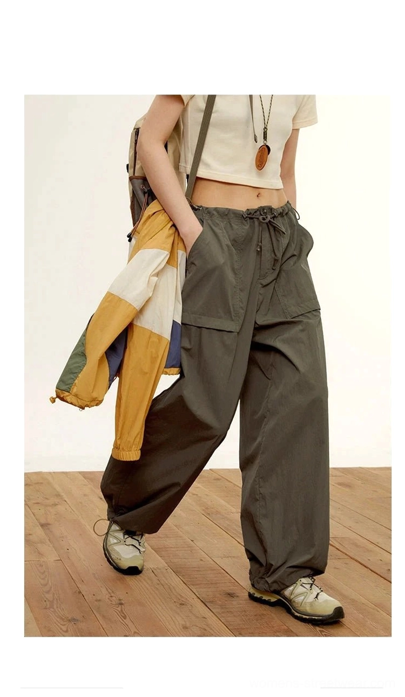 relaxed nylon cargo pants dark gray three-quarter side view oversized cargo pockets drawstring