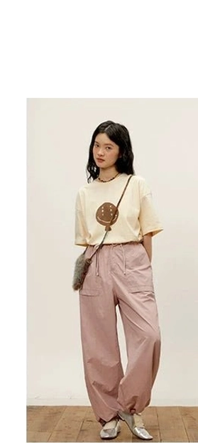relaxed nylon cargo pants dusty pink front static full-body tapered ankle hem cargo details