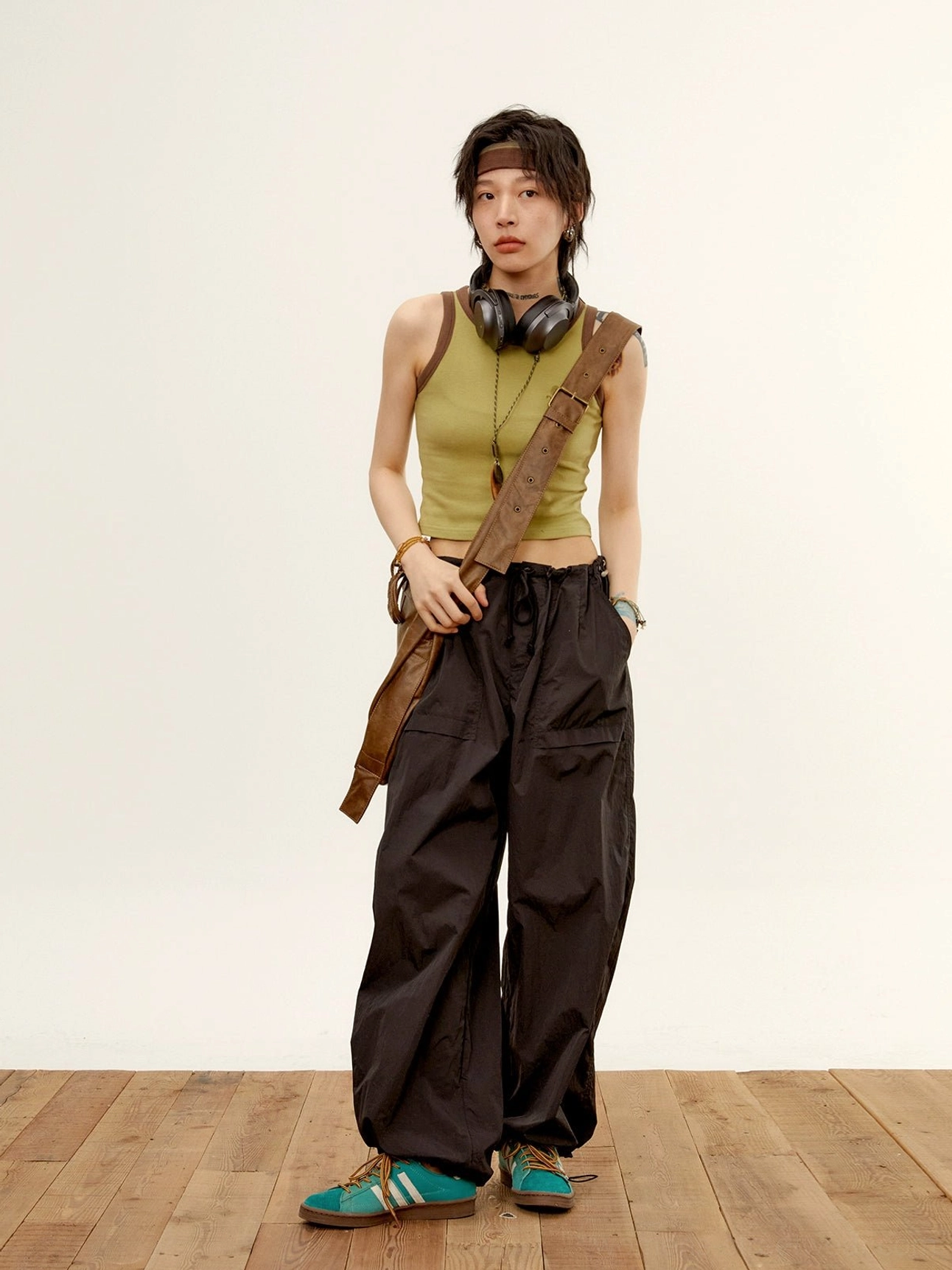 relaxed nylon cargo pants jet black high-waisted wide-leg streetwear casual standing with headband