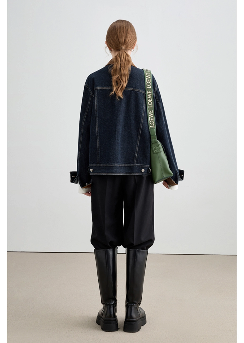 Relaxed denim outerwear jacket with statement turn-back cuffs, chest pockets, and vintage-inspired streetwear design