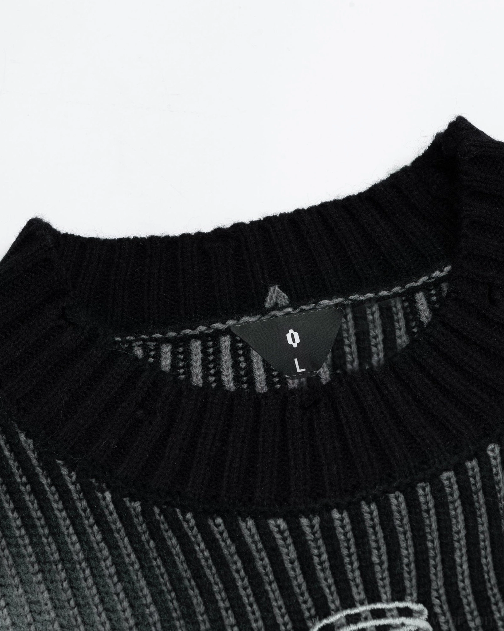 Relaxed distressed ribbed sweater with crew neck and oversized silhouette for everyday urban fashion