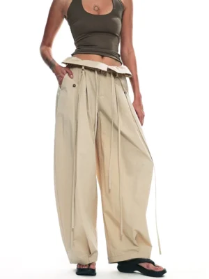 Apricot relaxed drawstring paperbag wide-leg streetwear trousers front view with pleated waist and loose full-length leg