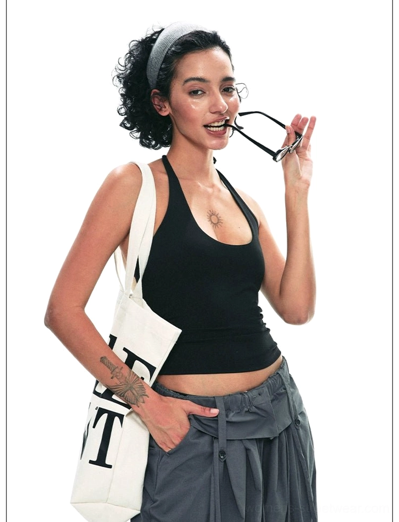 Dark gray drawstring paperbag wide-leg trousers full front outfit view with black tank top and casual canvas tote