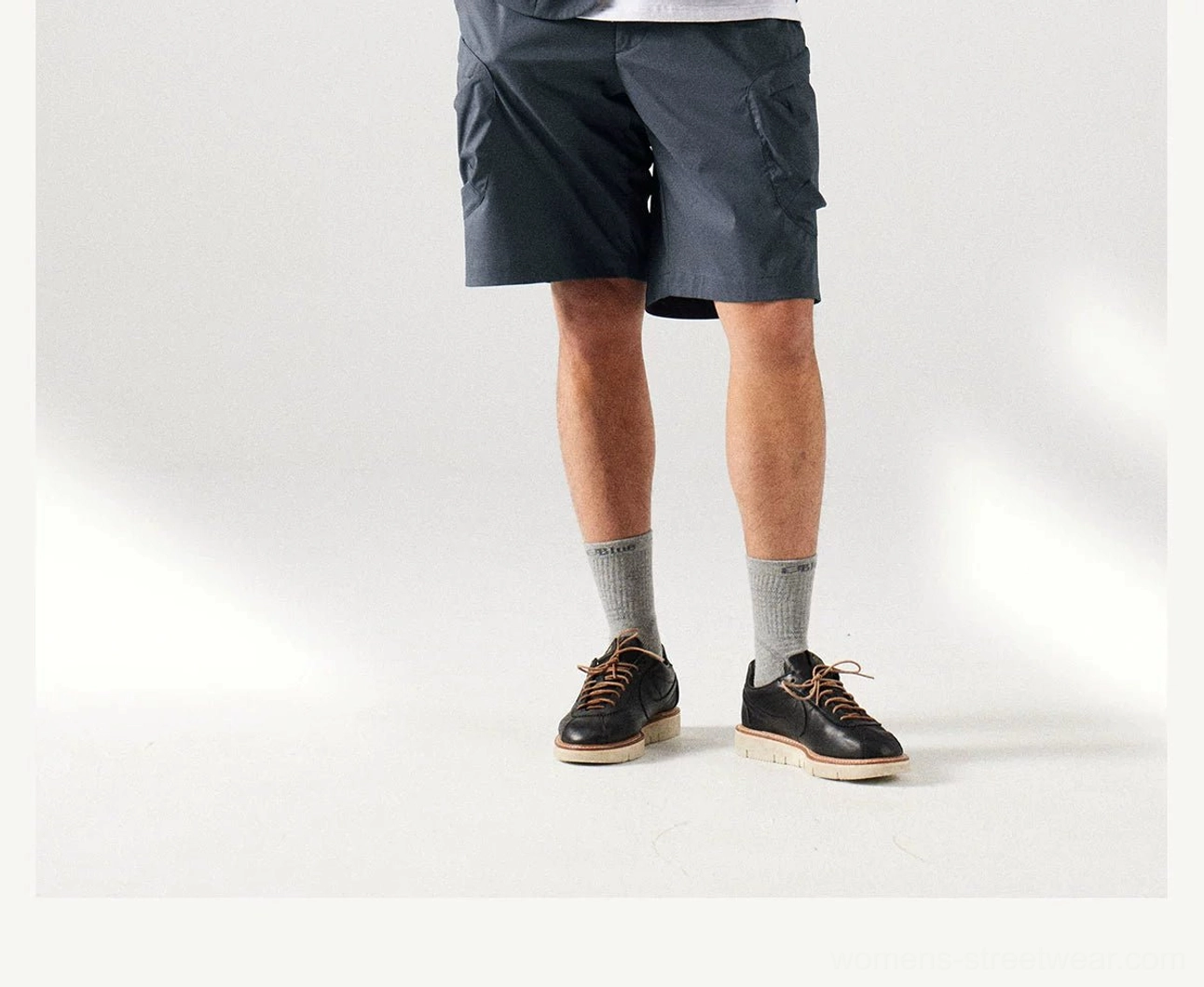 Relaxed fit cargo shorts in outdoor streetwear style with multi-pocket utility detailing and smooth matte finish