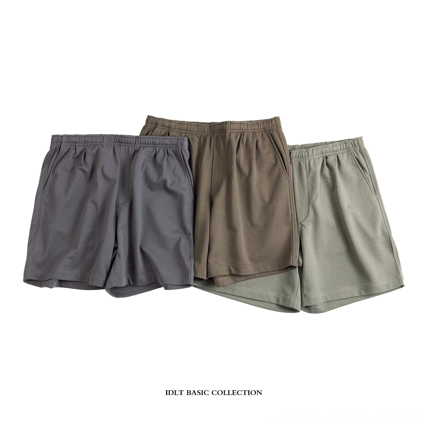 Three color relaxed fit French terry streetwear shorts collection in charcoal gray, taupe brown and sage green arranged in a flat lay