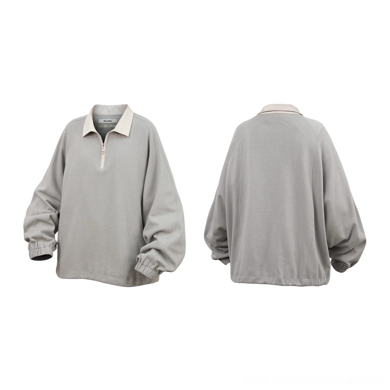 Relaxed fit half-zip raglan polo pullover with quarter-zip neckline and layered streetwear styling