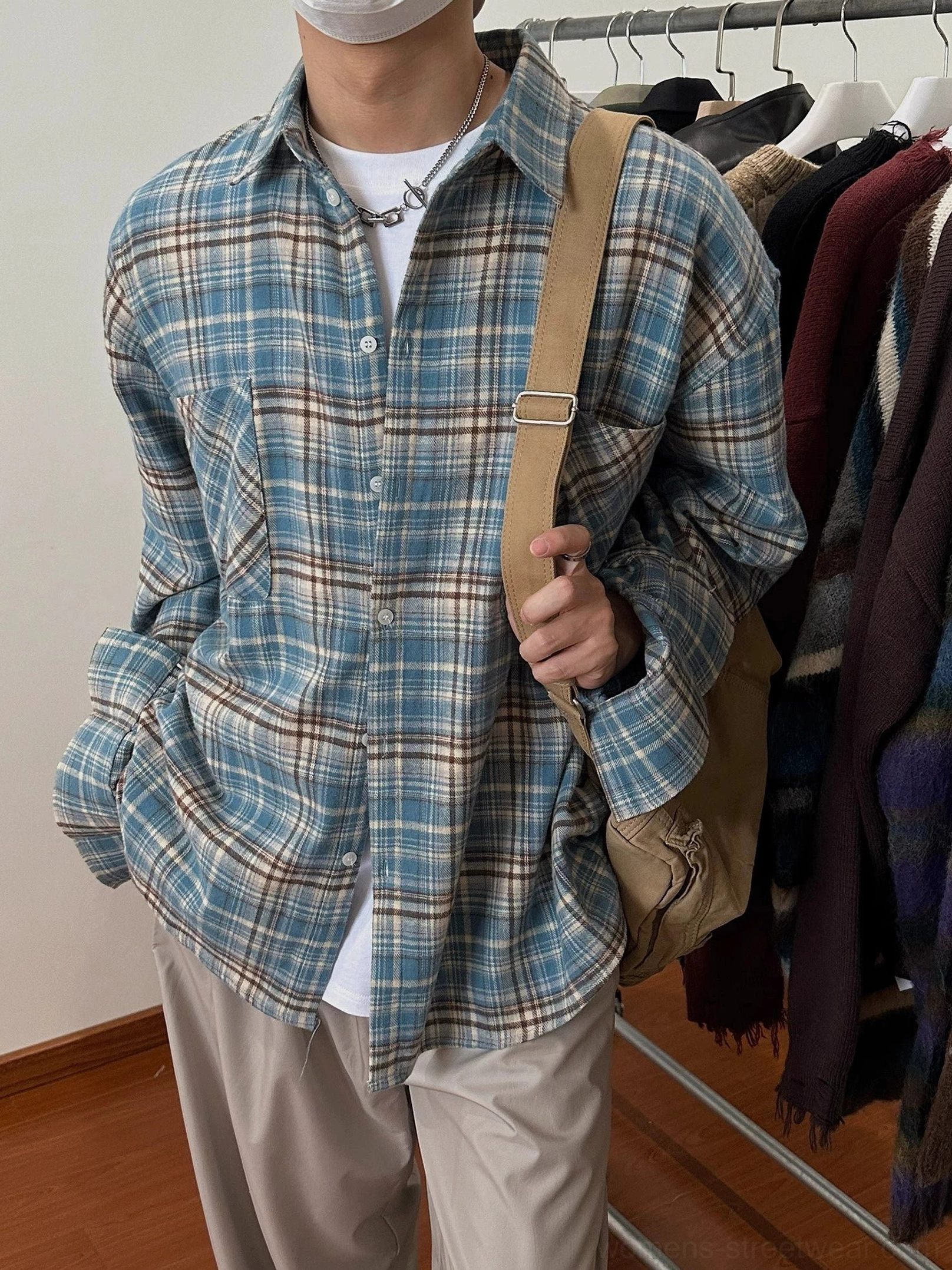 Relaxed fit plaid flannel shirt with button front chest pocket and drop shoulder streetwear styling
