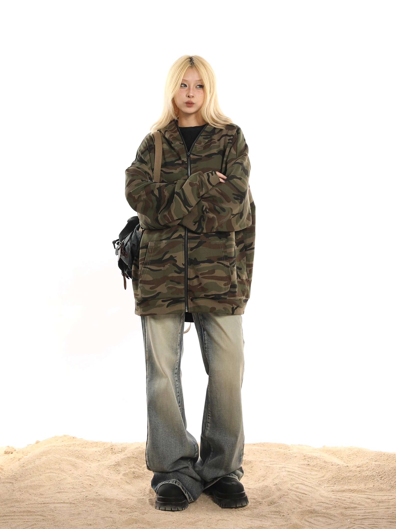 Relaxed oversized green camouflage jacket with drop shoulder sleeves styled for Korean and Seoul-inspired fashion