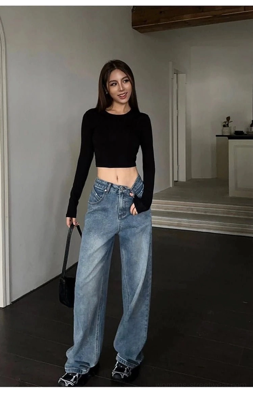 Relaxed fit high-waist wide-leg blue denim jeans styled in a minimalist indoor home setting