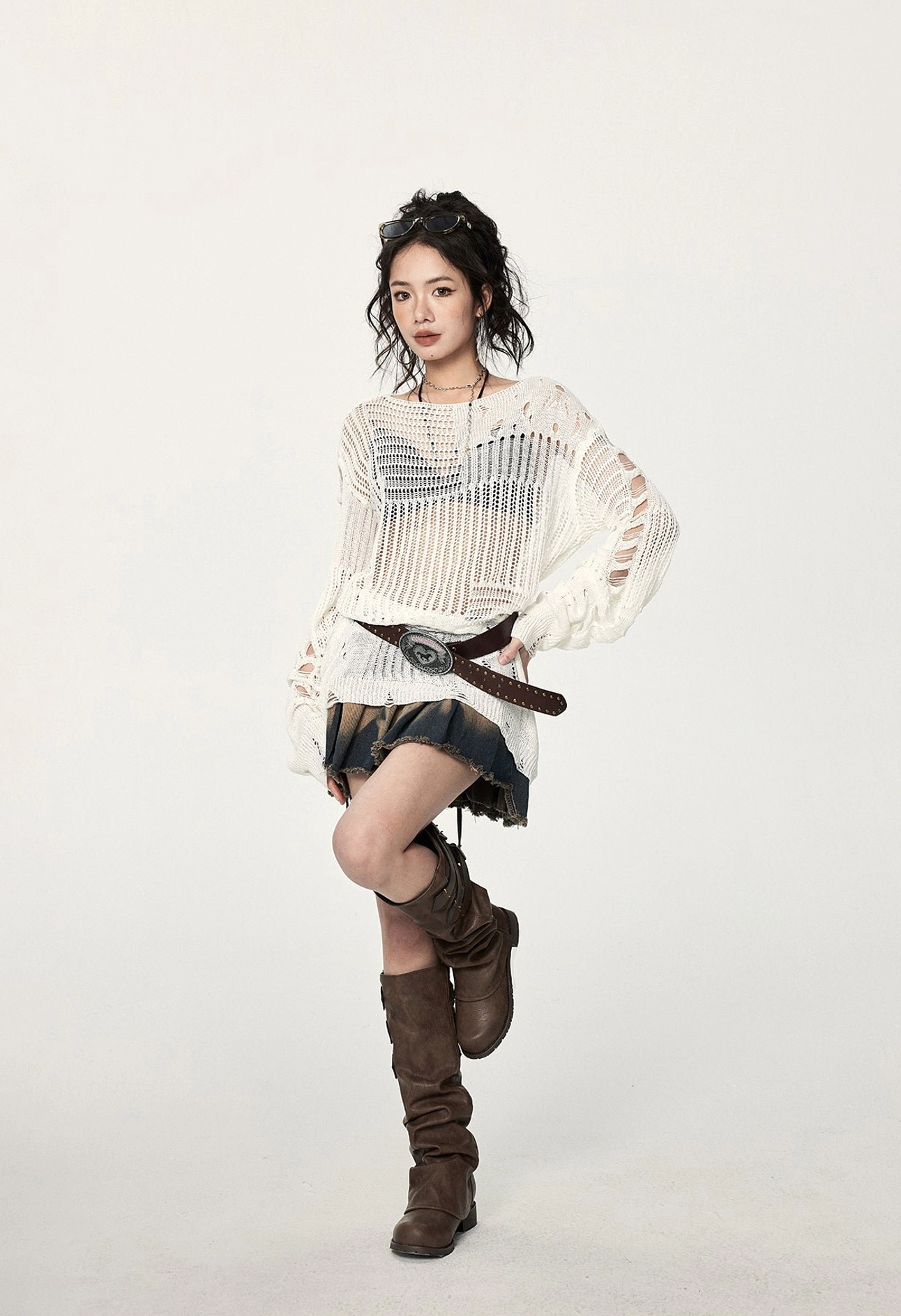 Relaxed off-white crochet streetwear sweater with irregular hem, distressed sleeves, airy knit panels, and contemporary Korean fashion influence