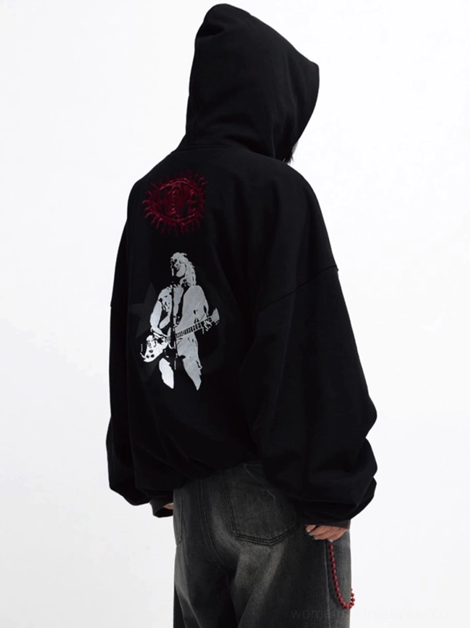 Full rear view of relaxed oversized black hoodie with white guitarist playing guitar and red circle logo
