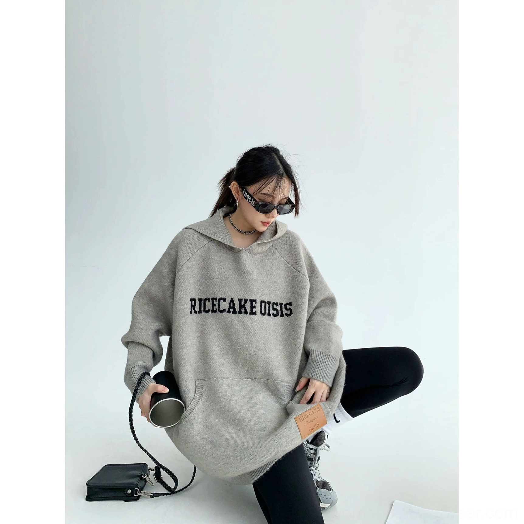 Relaxed oversized knit hoodie featuring bold front lettering, plush polyester knit texture, long sleeves, and casual Korean style