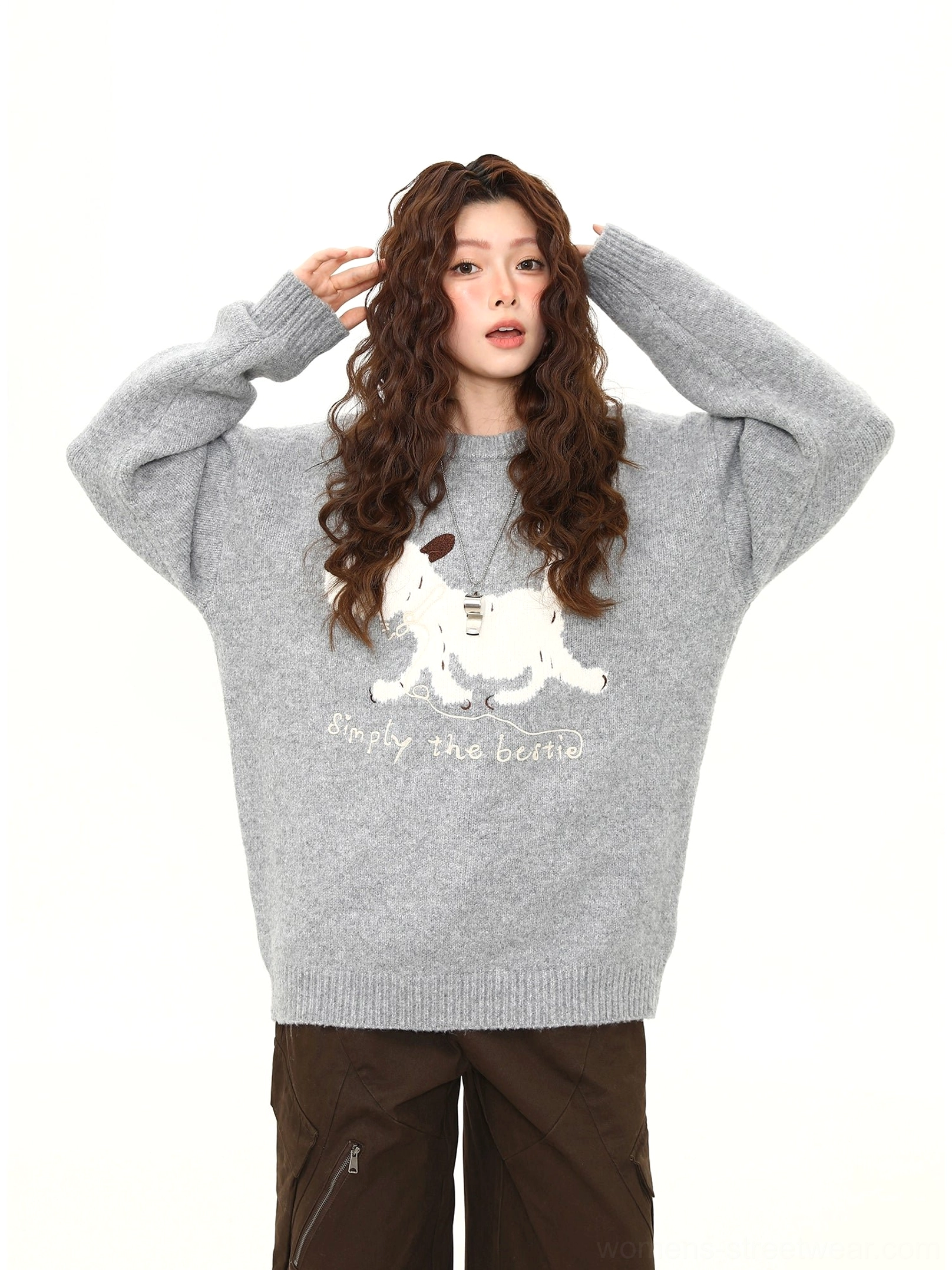 Relaxed loose-fit puppy print knit sweater showing the front dog artwork and bestie slogan