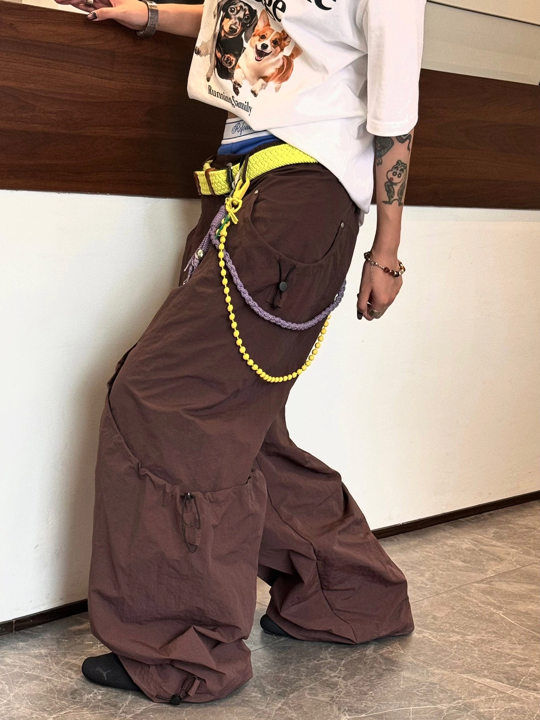 Relaxed streetwear cargo pants with loose wide leg fit technical fabric and functional drawstring details