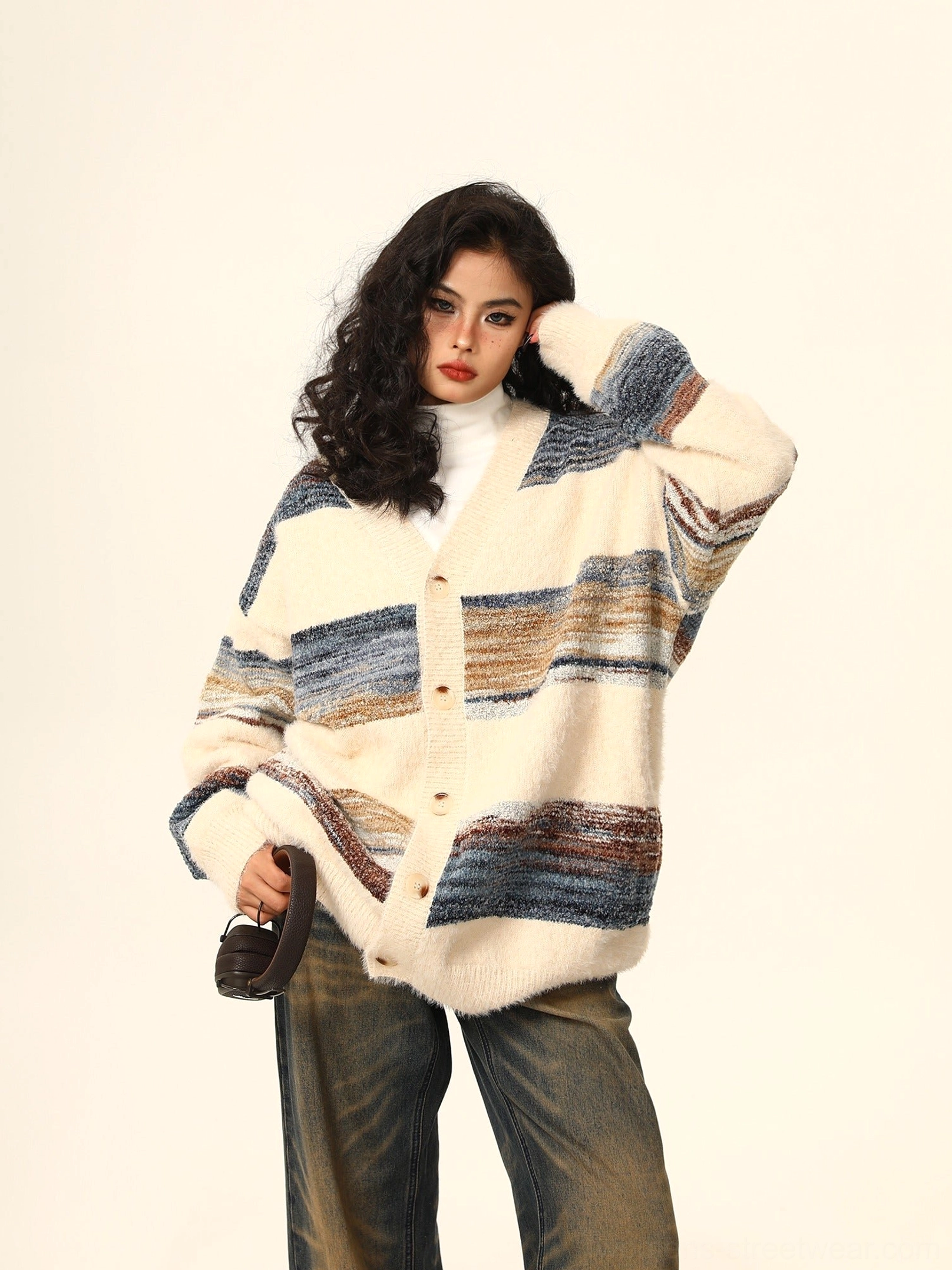 Relaxed striped mohair cardigan shown from the side and back with long sleeves fuzzy knit texture and oversized silhouette
