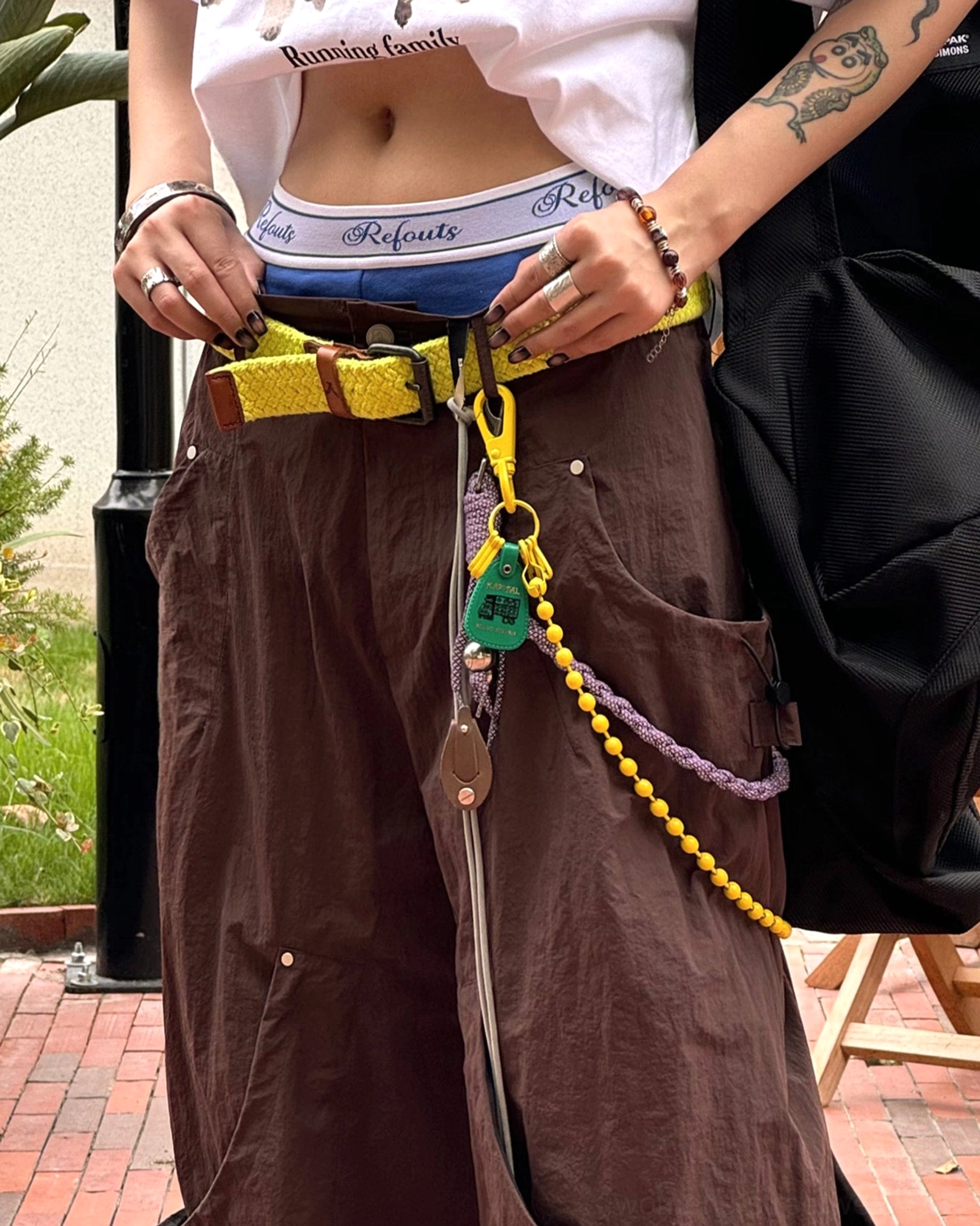Relaxed technical streetwear pants with wide leg cut cargo pockets and adjustable utility styling