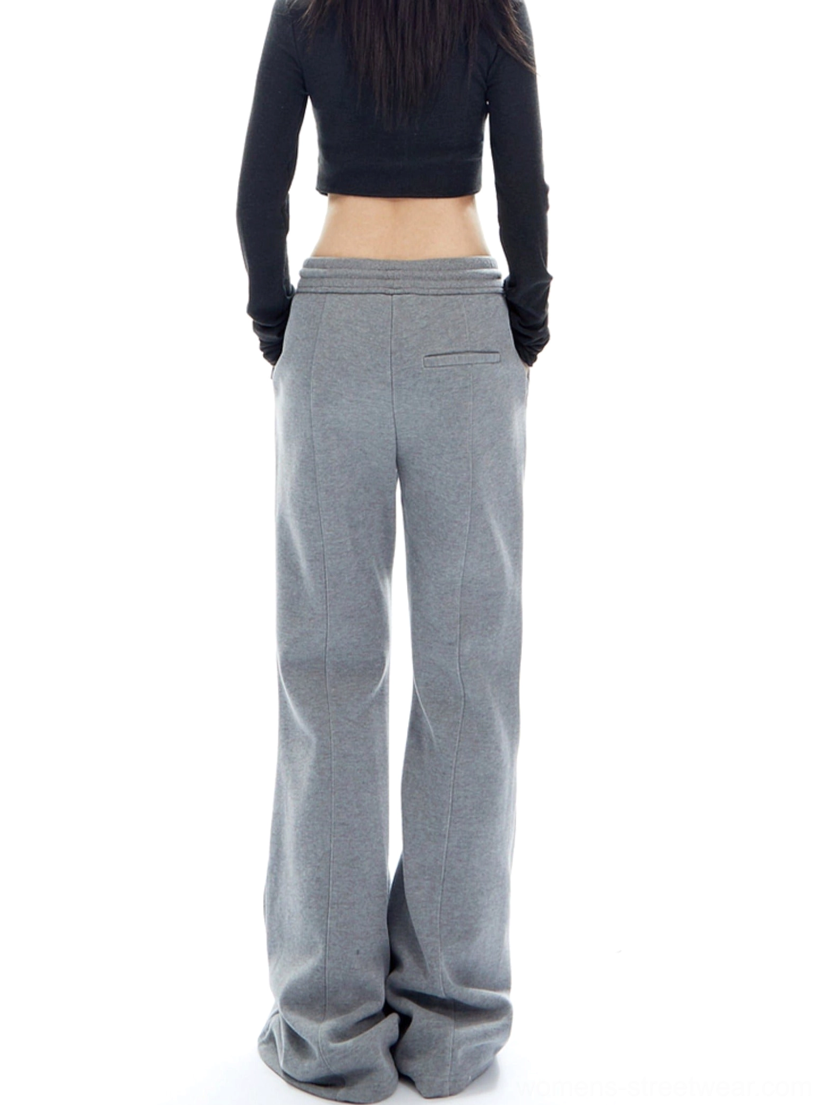 Relaxed women's flared pants featuring a comfortable drawstring waist and minimalist streetwear design