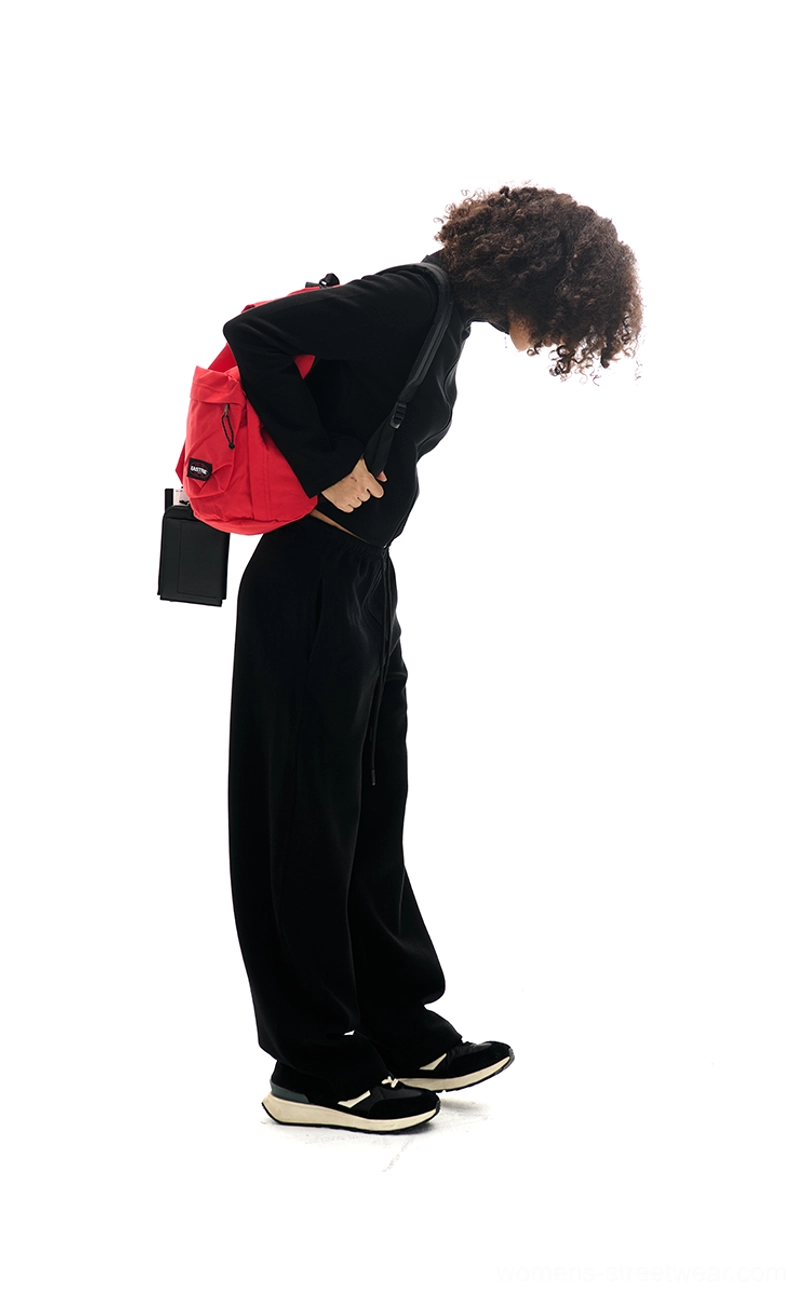 Relaxed women's loungewear set featuring cropped zip-up sweatshirt and high-waisted wide-leg pants
