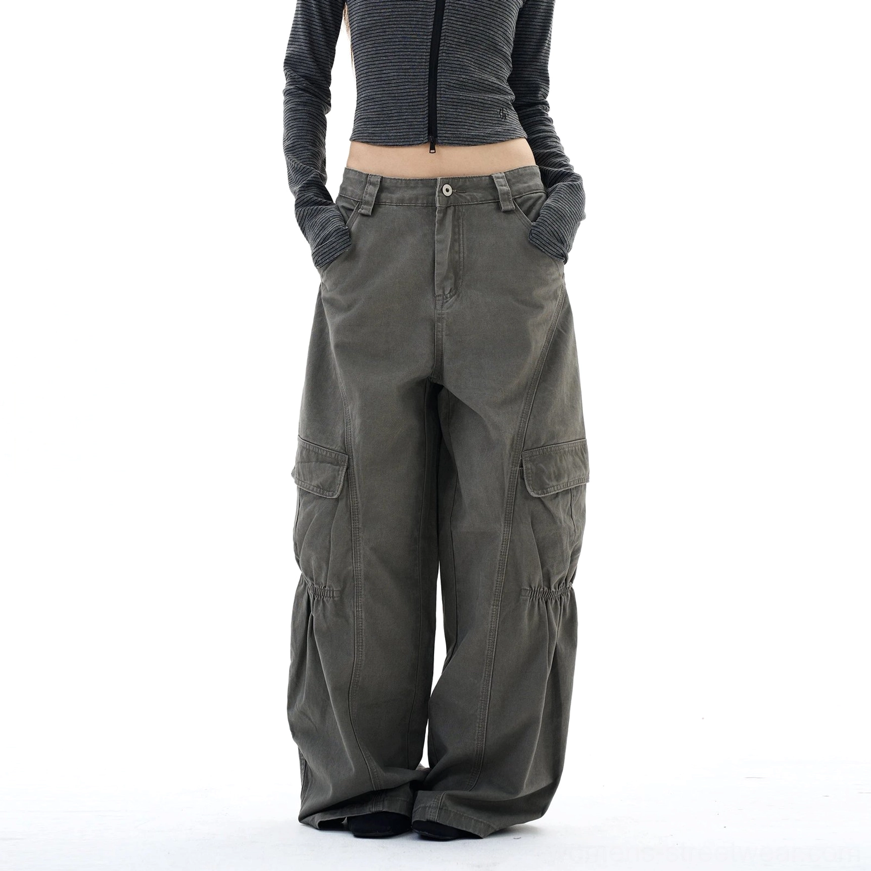 Front view of relaxed women's streetwear cargo pants showing the belt loops, neat button closure, and wide-leg drape