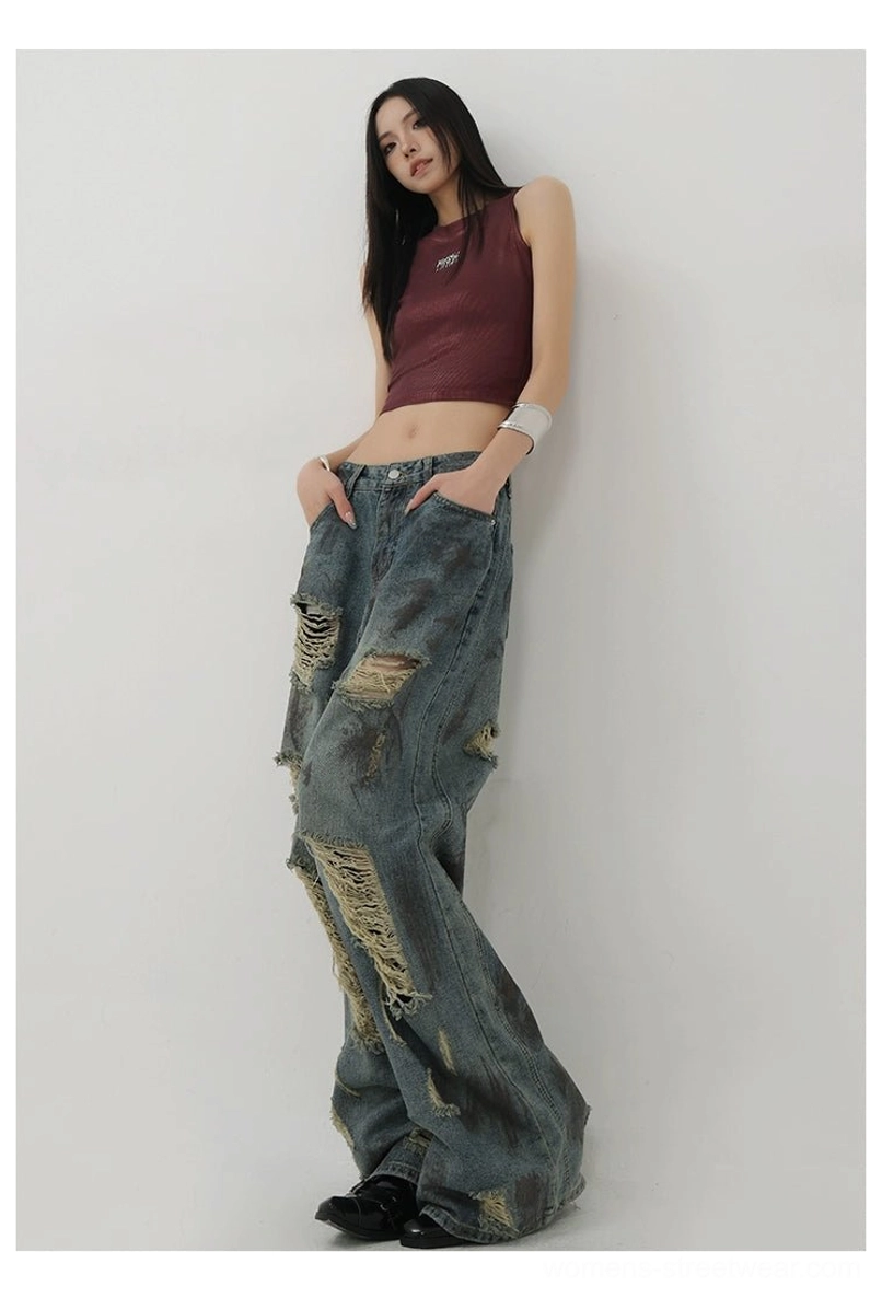 Relaxed women's wide-leg jeans in faded blue denim with distressed details for Y2K and Seoul-inspired outfits