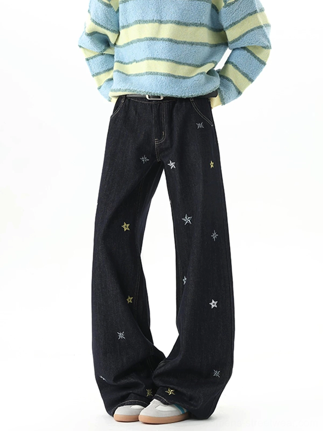 Front view of relaxed Y2K wide-leg denim jeans featuring scattered celestial star embroidery and belt loops
