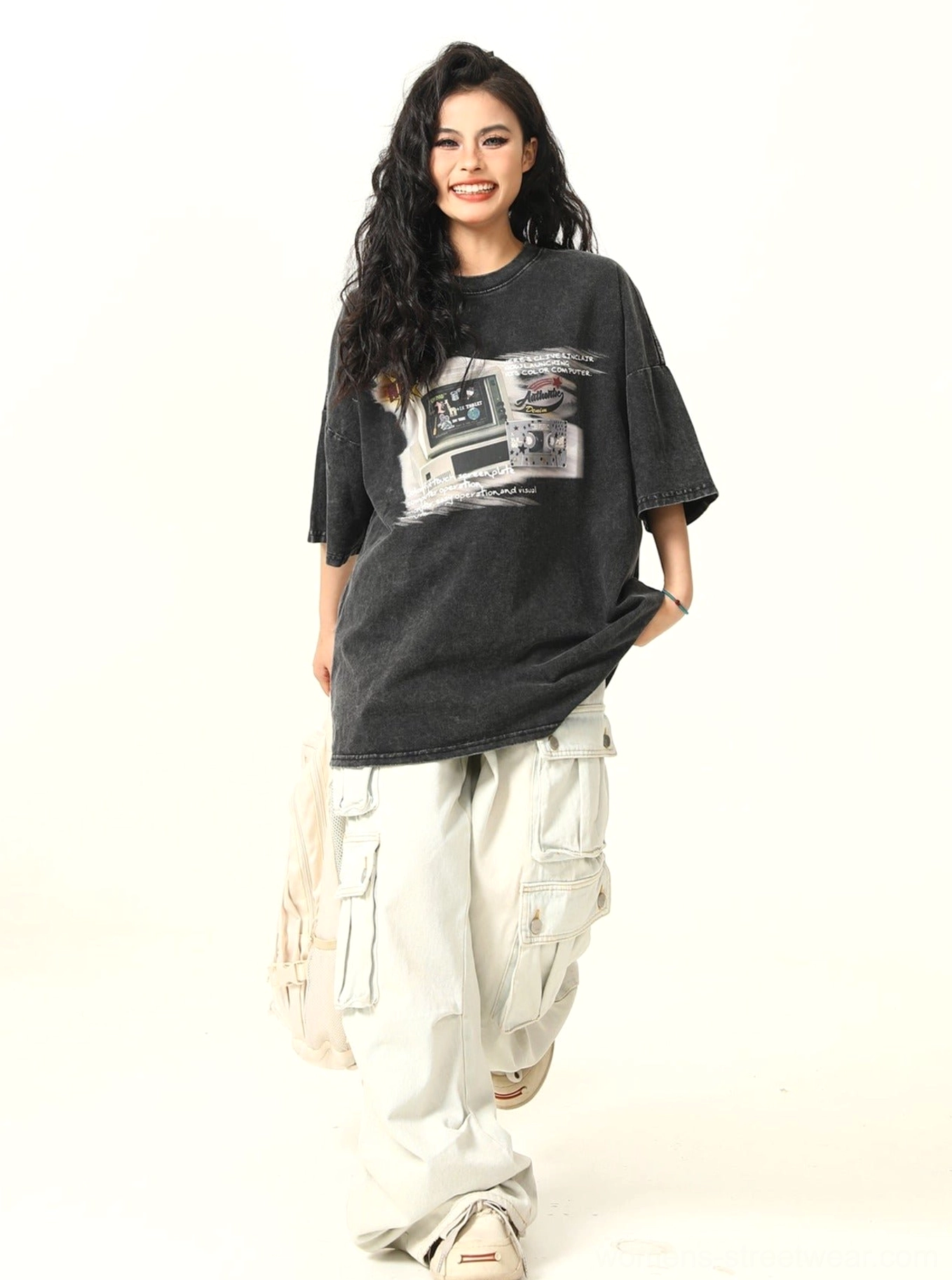 Women’s relaxed retro arcade graphic T-shirt showing oversized streetwear fit and front print