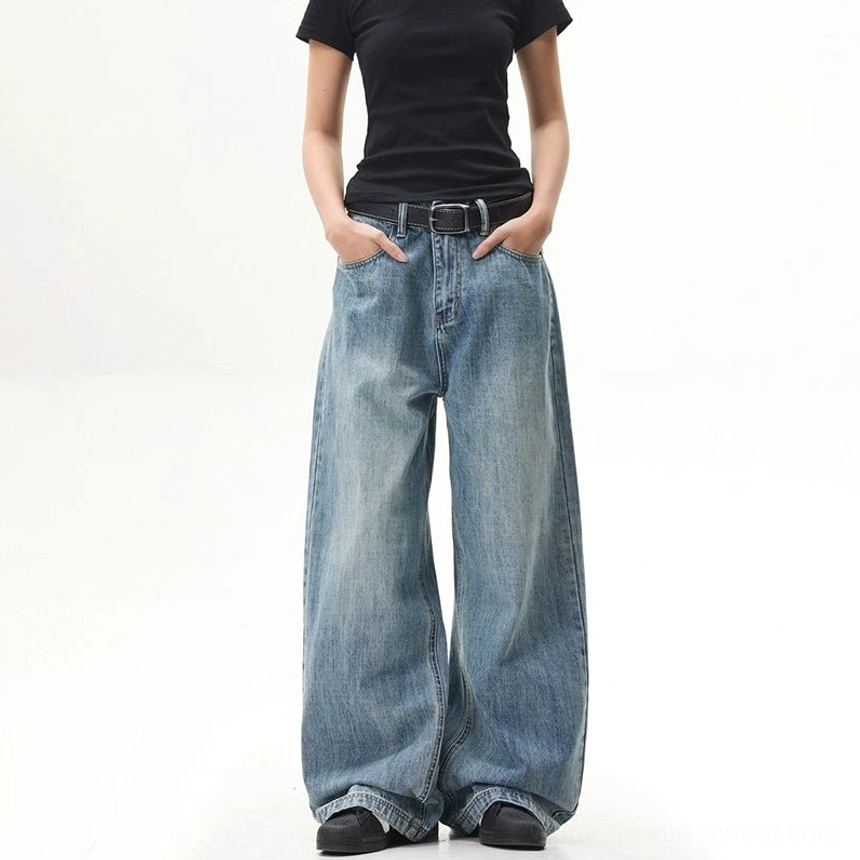 Front view of retro blue ultra-wide baggy jeans with hands in pockets and a relaxed Korean street fashion silhouette