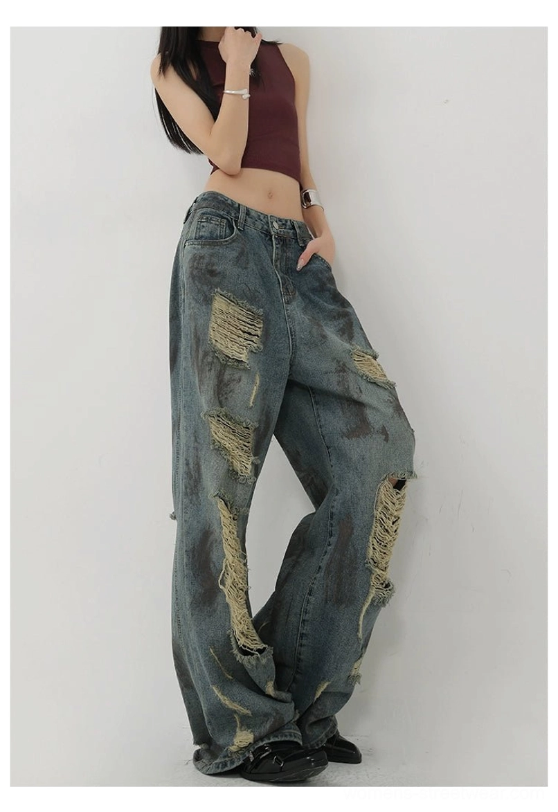 Retro blue wide-leg denim jeans with washed tie-dye effect, ripped detailing, and loose casual silhouette