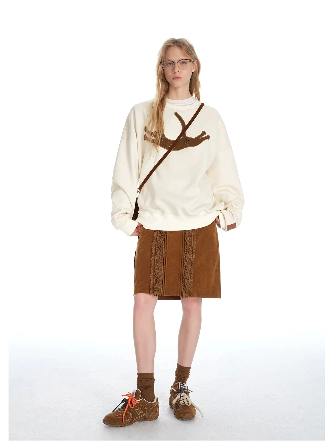 Retro brown corduroy midi skirt with front ruffled lace decoration paired with a deer graphic sweatshirt and crossbody bag