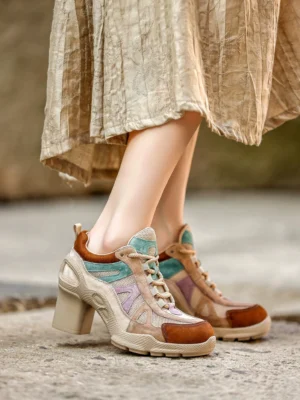 Side view of women’s Brown Mix retro mesh and faux leather platform block heel sneakers